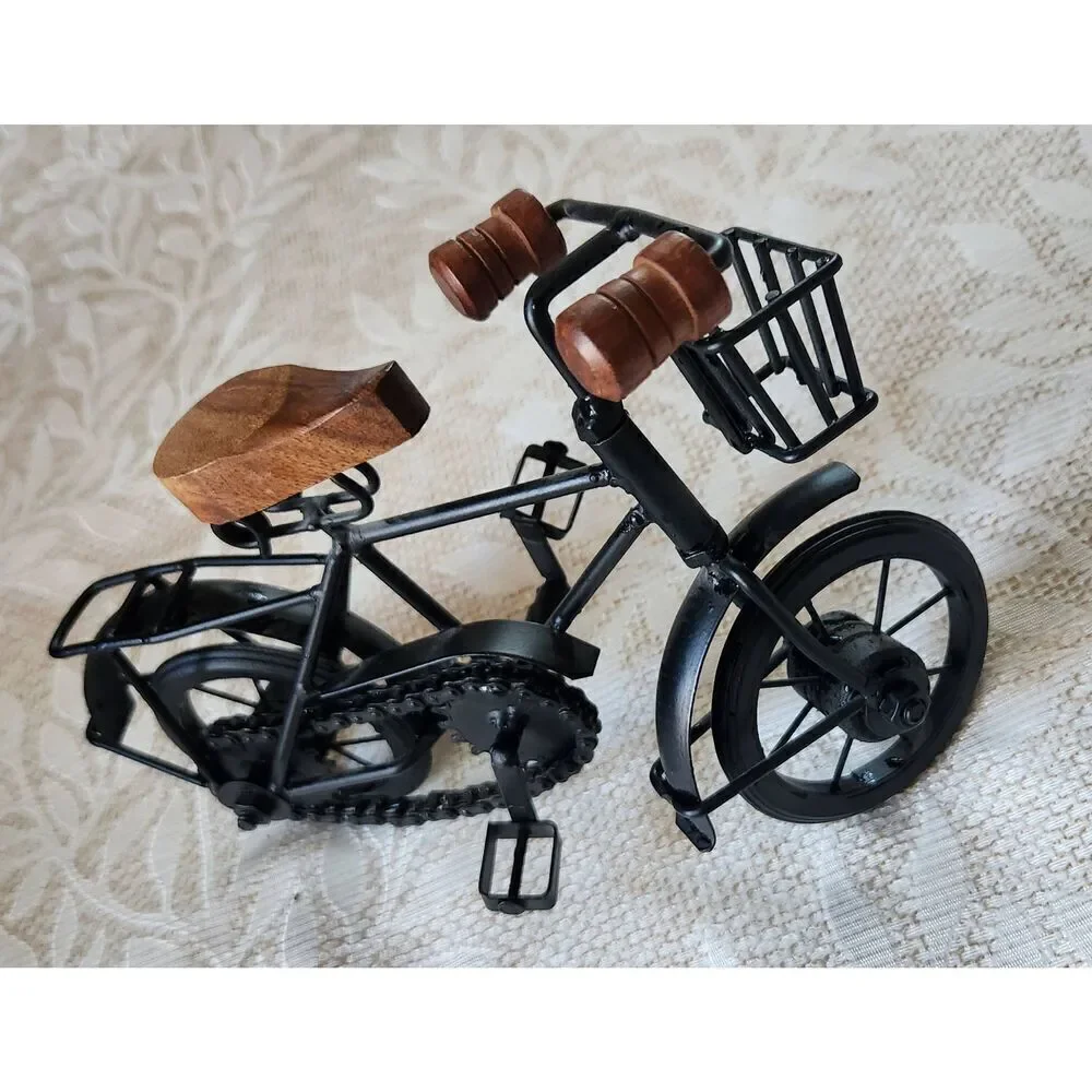 Cute black metal and wood standing bicycle decor with movable pedals and chain